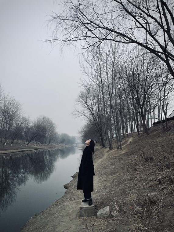 Courtside 07 / Figure beside a quiet canal