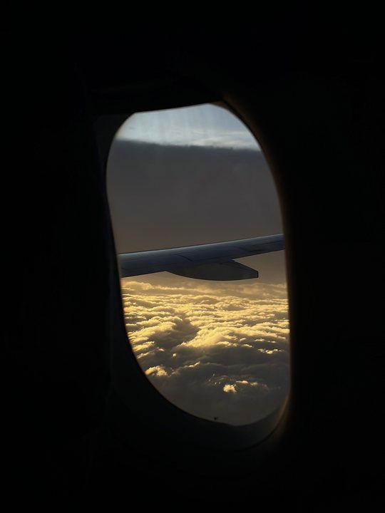 Foreign Body 06 / Airplane window above clouds