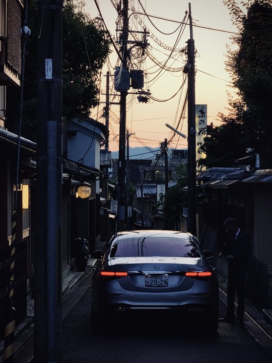 Foreign Body 11 / Narrow street with a car at evening