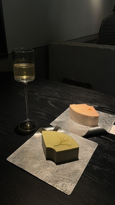 Foreign Body 20 / Wine glass and small objects on a dark table