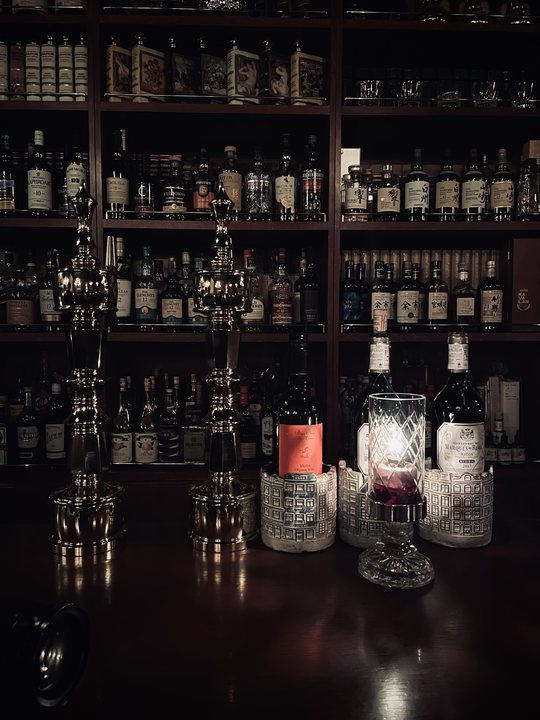 Foreign Body 21 / Dark bar shelf with bottles